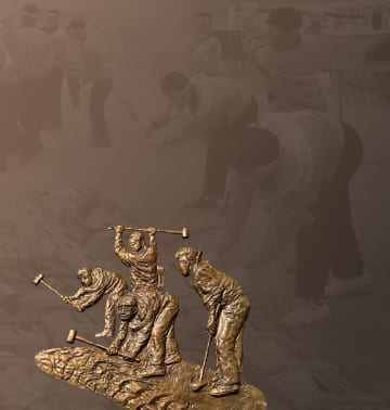 A photo and relief of employees destroying 150,000 defective products with hammers at Samsung Electronics' Gumi Plant in 1995.