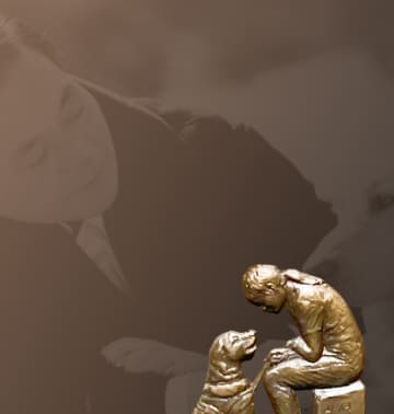 A relief of a guide dog and a visually impaired person facing each other and a background photo of Chairman Lee Kun-hee petting a guide dog.